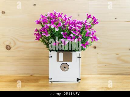 concept recycle floppy disk, flower in disk box, Creative objects used for obsolete furniture Stock Photo