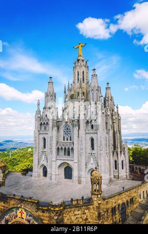 Famous church in Barcelona city with statue of Jesus at the top. Temple of the Sacred Heart of Jesus in Barcelona Stock Photo