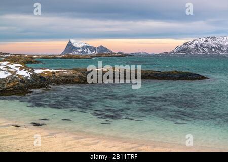 Coastal landscape on the island of Sommarøy with a view of the island of Håja, Norway Stock Photo