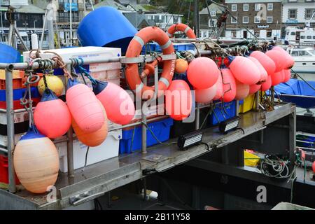 Buoys and fishing containers on a fishing boat (trawler) in Padstow, Cornwall, UK Stock Photo