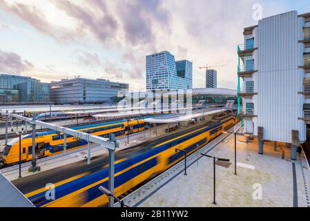 Departing Train at Central Station of Utrecht, Netherlands. Being located in the center of the country Utrecht Central Station is a major transit hub. Stock Photo