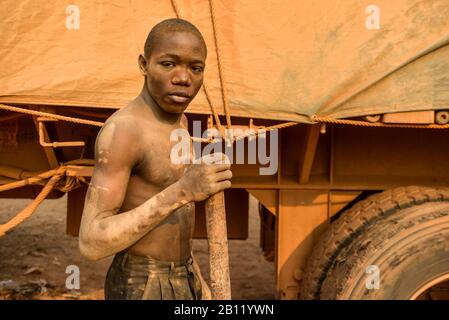 Congolese man repairs tires, southern half of the Democratic Republic of the Congo, Africa Stock Photo