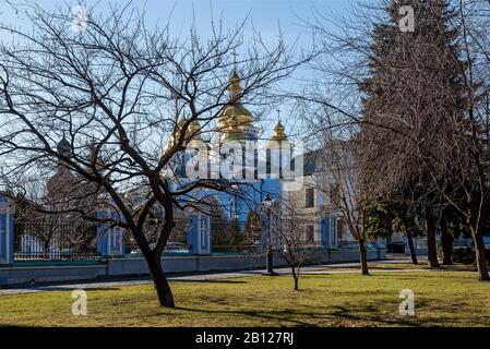 View from the park to the Mikhailovsky Monastery. St. Michael's Monastery, an architectural structure of the Orthodox church with golden domes, Kiev U Stock Photo