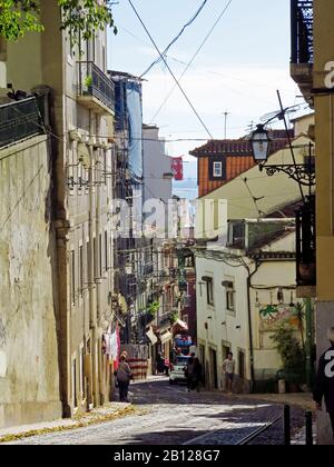 The historic district of Alfama has lot of narrow streets and many Fado restaurants. Stock Photo