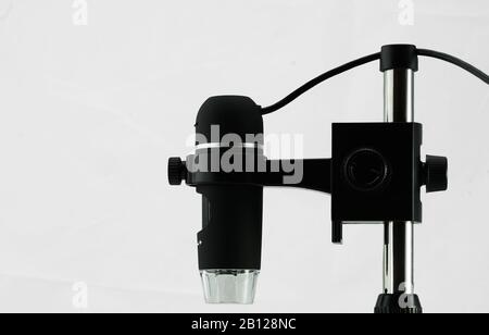 USB microscope, side view against white background Stock Photo