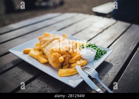 Fish and chips, typical British lunch, restaurant on the beach, Brighton, England Fish and chips, typical British lunch, restaurant on the beach, Brighton, England Stock Photo