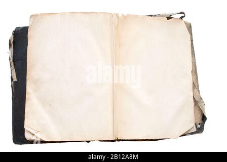 antique black Bible with open blank pages on an isolated white background. The Bible is torn and quite grungy. Stock Photo