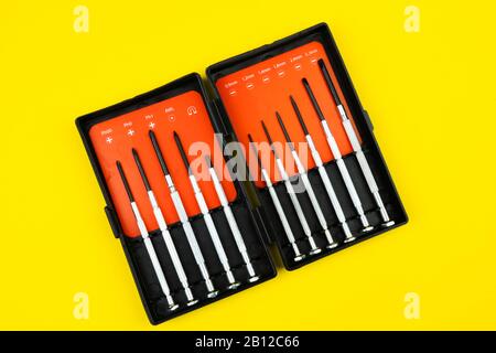 set of screwdrivers on a yellow background isolated d Stock Photo