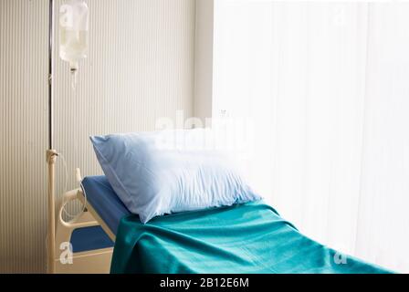 Empty patient bed in hospital Stock Photo