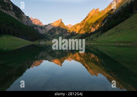 Alpenglow at Säntis with Seealpsee, Appenzeller Alps, Switzerland Stock Photo