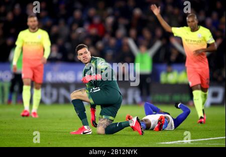 Manchester City goalkeeper Ederson reacts after colliding with Leicester City's Kelechi Iheanacho during the Premier League match at the King Power Stadium, Leicester. Stock Photo