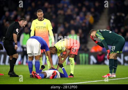 Leicester City's Kelechi Iheanacho receives attention after colliding with Manchester City goalkeeper Ederson (right) during the Premier League match at the King Power Stadium, Leicester. Stock Photo