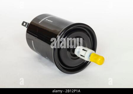 The Car filter for benzine of the black colour. New detail of the round form insulated on light background Stock Photo