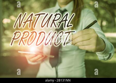 Handwriting text writing Natural Product. Conceptual photo chemical compound or substance produced by a living organism Woman in a blue business shirt Stock Photo