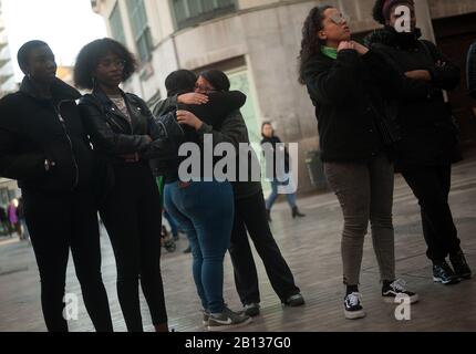 A woman cries as she is being embraced by another during a protest against gender -based violence in Mexico.Mexican women living in Spain participate in a protest against the feminicide of seven-year-old Fatima Cecilia Aldrighett in Mexico. They also claim justice and responsibility facing government of Manuel Lopez Obrador. Stock Photo