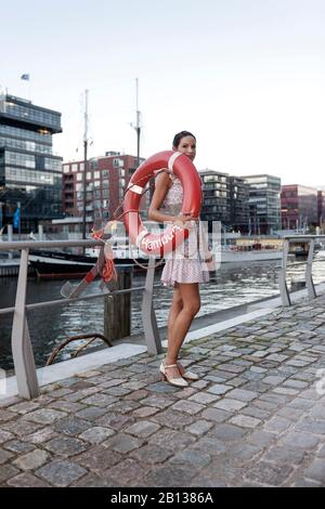 Young woman,summer dress,HafenCity,Hamburg,Germany Stock Photo