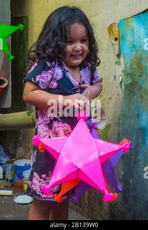 Filipino girl holding a lantern in a Christmas market in Las Pinas city , Manila the Philippines Stock Photo