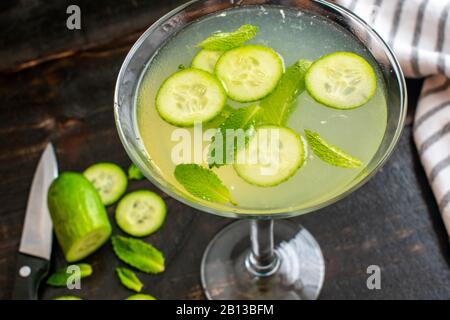 Cucumber Mint Martini: A vodka cocktail made with cucumber, mint, and lime juice served in a martini glass Stock Photo