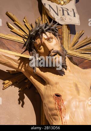 BOLOGNA, ITALY - FEBRUARY 3, 2020: The the carved statue of Jesus on the cross in baroque church San Michele in Bosco. Stock Photo