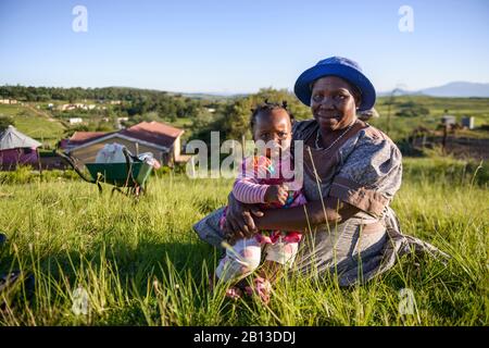 Elderly woman with baby from Zulu tribe,Kwazulu Natal,South Africa Stock Photo