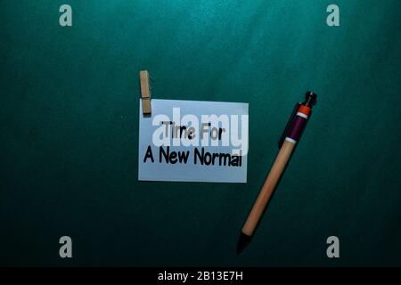 Time For A New Normal write on a sticky note isolated on Office Desk Stock Photo