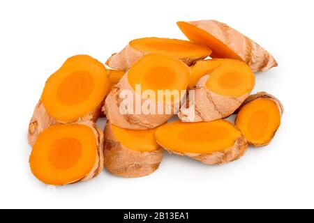 turmeric root slices isolated on white background close up. Stock Photo