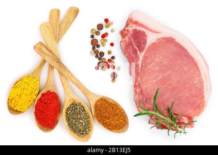 mix of spices in wooden spoon isolated on a white background with copy space for your text. Top view. Flat lay. Set or collection. Stock Photo