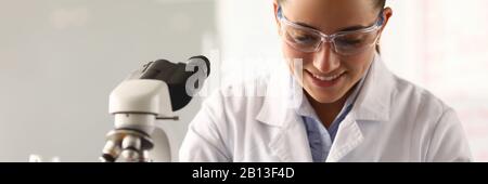 Beautiful woman in white medical gown Stock Photo