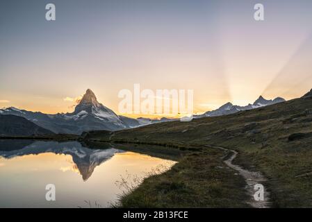 The Matterhorn reflected in Stellisee at sunset,Switzerland Stock Photo