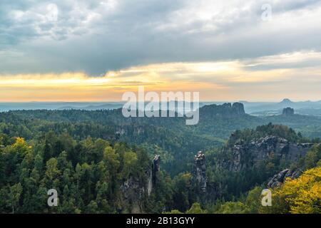 View from the Carolafelsen on the Schrammsteine and Falkenstein in the evening,Elbe Sandstone Mountains,Saxony,Germany Stock Photo