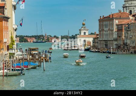 VENICE, ITALY - August 02, 2019: Grand Canal with Basilica di Santa Maria della Salute in Venice, Italy. View of Venice Grand Canal in sunny day. Arch Stock Photo