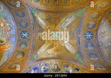 RAVENNA, ITALY - JANUARY 28, 2020: The early christian mosaic with the Christ symbol, four angels and symbols of four evangelists in the Saint Andrew Stock Photo