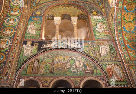 Ravenna - The mosaic of scenes Abraham Hosts the Tree Angels and The Sacrifice of Isaac in presbytery of the church Basilica di San Vitale. Stock Photo