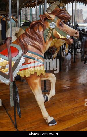 Brooklyn, New York: One of the 48 carved and painted wooden horses in Jane’s Carousel, 1922, Brooklyn Bridge Park. Stock Photo