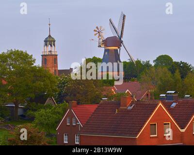 Church tower and mill of Ditzum,Jemgum,East Frisia,Lower Saxony,Germany Stock Photo