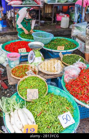 Bangkok, Thailand - January 5th 2010: Vegetable vendor on Khlong Toei market, The market is the largest wet market in the city, Stock Photo