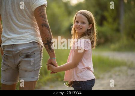 Father and daughter together in the forest Stock Photo