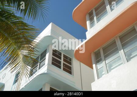 Miami Art Deco District on Ocean Drive, detail. Colorful concrete slab eaves, palm trees and blue sky on sunny South Beach, Florida. Stock Photo