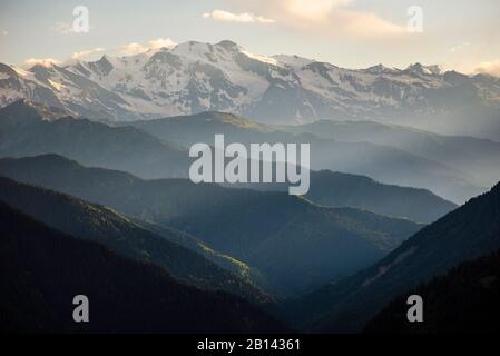 Forested mountain ridges of the Great Caucasus in oblique light, Upper Swanetia, Georgia Stock Photo