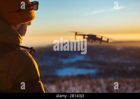 Photographer with Drone in winter Stock Photo