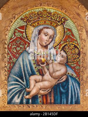 FERRARA, ITALY - JANUARY 30, 2020: The  ceramic Madonna in church Basilica di San Giorgio fuori le mura. Stock Photo
