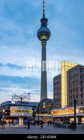 World time clock, train station and Berolina House on Alexanderplatz, in the back television tower, Mitte, Berlin