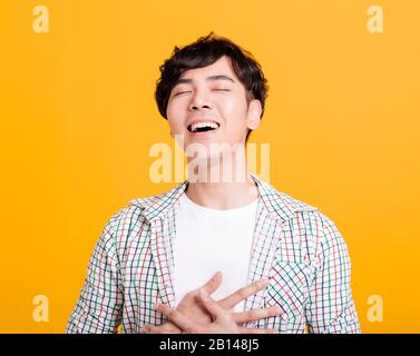 happy Asian young  man with laugh face Stock Photo