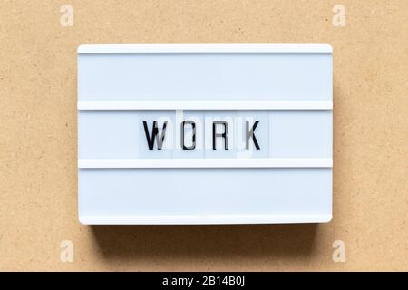 White lightbox with word work on wood background Stock Photo