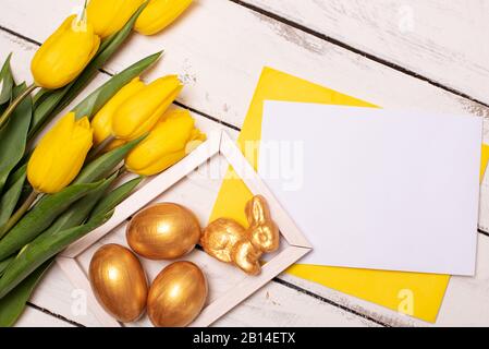 Happy Easter. Congratulatory easter background. Easter eggs and flowers Stock Photo