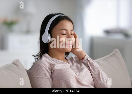 African American woman in headphones enjoy music Stock Photo