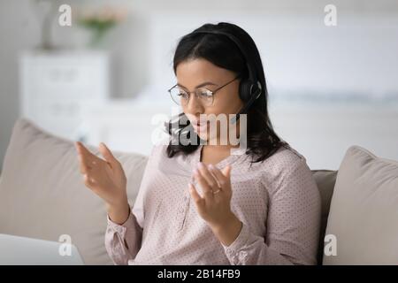 African American agent in headset consult client online Stock Photo