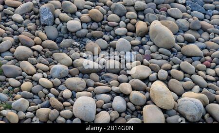 Background of round stones in various sizes. Stock Photo