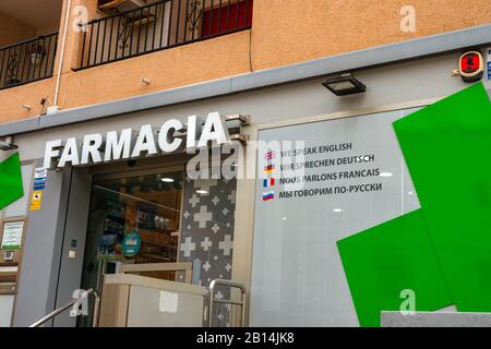 Pharmacy, Chemist, sign in Spain written in four languages, We Speak English, La Mata, Costa Blanca, Spain Stock Photo