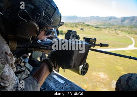 U.S. Marine Corps Cpl. Austin Bail, Scout Sniper with 1st Reconnaissance Battalion, 1st Marine Division, conducts live fire sniper aerial shooting from a UH-1Y 'Venom' helicopter as part of the Aerial Snipers Course at Range-440, Marine Corps Base Camp Pendleton Calif., April 18, 2019. The Aerial Snipers course trains Marine Corps snipers to engage targets from a moving aircraft. (U.S. Marine Corps photo by Cpl. Megan Roses)